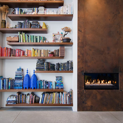 Inspiration for a contemporary concrete floor living room remodel in Salt Lake City with a metal fireplace