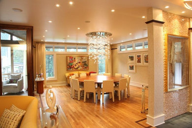 Dining room - light wood floor dining room idea in Atlanta with beige walls and no fireplace