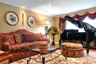 Mid-sized formal and enclosed medium tone wood floor living room photo in New York with yellow walls