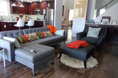 Transitional open concept dark wood floor and brown floor living room photo in Phoenix with no tv
