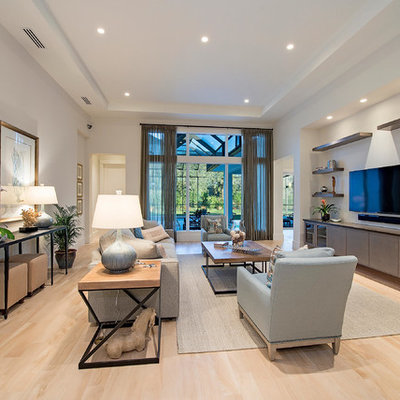 Example of a large transitional open concept living room design in Miami with white walls and a wall-mounted tv