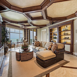 Island style living room photo in Miami with beige walls and a media wall