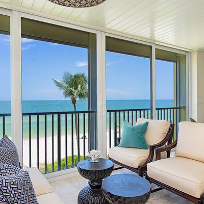 Inspiration for a large tropical formal and open concept ceramic tile and beige floor living room remodel in Miami with beige walls, no fireplace and no tv