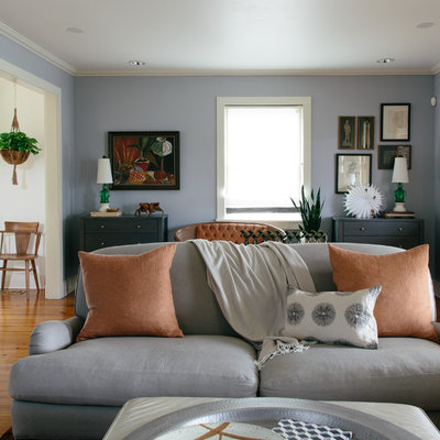 Living room - eclectic enclosed and formal medium tone wood floor living room idea in New Orleans with blue walls