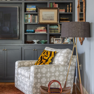 Living room - eclectic formal and enclosed medium tone wood floor living room idea in New Orleans with blue walls