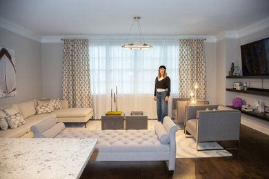 Mid-sized trendy open concept dark wood floor and brown floor living room photo in Nashville with gray walls and a media wall