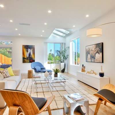 Inspiration for a contemporary formal light wood floor living room remodel in Los Angeles with white walls