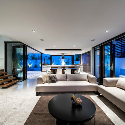 Inspiration for a large contemporary open concept beige floor living room remodel in Perth with white walls