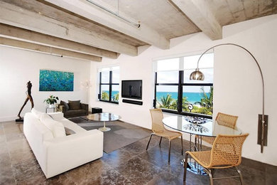 Example of a mid-sized urban formal and open concept concrete floor and gray floor living room design in Miami with white walls, no fireplace and a wall-mounted tv