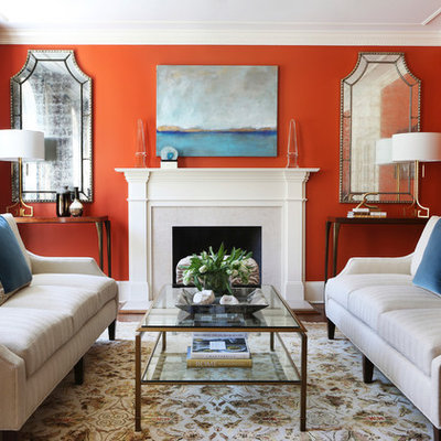 Example of a mid-sized classic formal and enclosed carpeted and multicolored floor living room design in New York with a standard fireplace, red walls, a stone fireplace and no tv