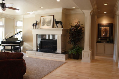 Photo of a medium sized classic formal open plan living room in Boise with beige walls, light hardwood flooring, a standard fireplace, a tiled fireplace surround and beige floors.