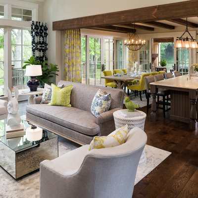 Inspiration for a large french country open concept and formal dark wood floor and brown floor living room remodel in Minneapolis with beige walls, a standard fireplace and a stone fireplace