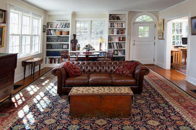 Living room - huge traditional open concept medium tone wood floor living room idea in Philadelphia with beige walls