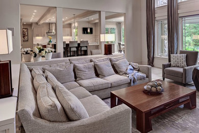 Huge transitional open concept living room photo in New York with beige walls