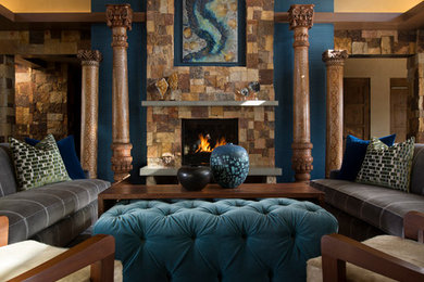 Foto de salón abierto clásico renovado grande sin televisor con paredes azules, suelo de pizarra, todas las chimeneas y marco de chimenea de piedra