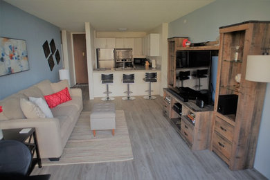 Living room - small traditional enclosed laminate floor and gray floor living room idea in Hawaii with blue walls and a tv stand