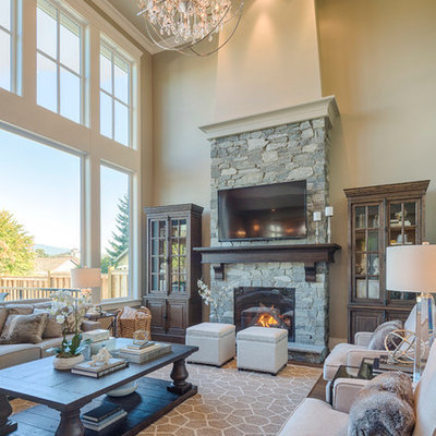 Inspiration for a mid-sized timeless open concept dark wood floor living room remodel in Vancouver with beige walls, a standard fireplace, a stone fireplace and a wall-mounted tv