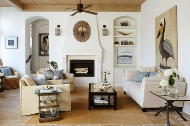 Inspiration for a coastal living room remodel in Birmingham with white walls and a standard fireplace