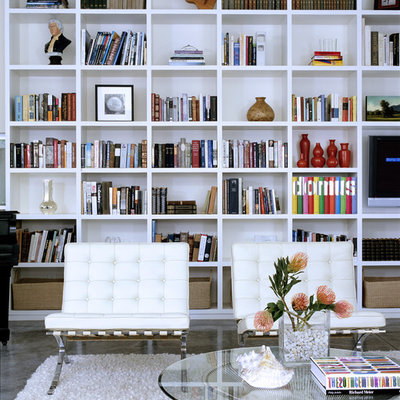 Mid-sized minimalist open concept concrete floor and gray floor living room library photo in Los Angeles with white walls, a standard fireplace, a tile fireplace and no tv