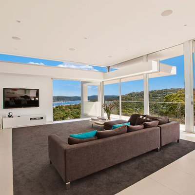 Large trendy open concept living room photo in Sydney with white walls, a wall-mounted tv and no fireplace