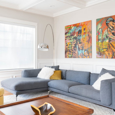 Inspiration for a contemporary formal medium tone wood floor and brown floor living room remodel in Boston with white walls