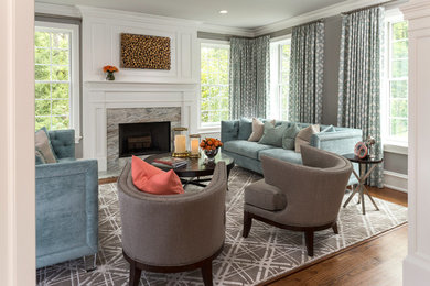 Living room - large transitional formal and enclosed medium tone wood floor living room idea in Philadelphia with gray walls, a standard fireplace and a stone fireplace