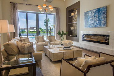 This is an example of a contemporary living room in Tampa with a tiled fireplace surround.