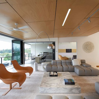 Large minimalist formal and open concept porcelain tile living room photo in Brisbane with white walls