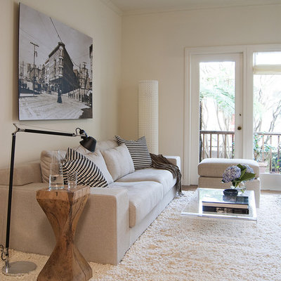 Living room - mid-sized transitional enclosed dark wood floor living room idea in San Francisco with white walls