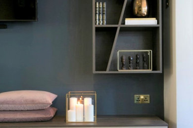 Living room - contemporary dark wood floor living room idea in London with brown walls