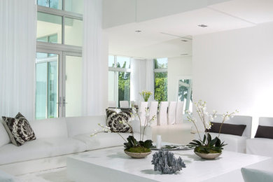 Foto di un grande soggiorno minimal stile loft con sala formale, pareti bianche, pavimento in gres porcellanato e nessuna TV