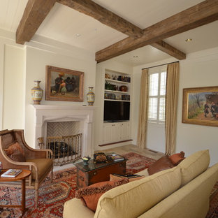 Photo of a traditional living room in Atlanta with beige walls and a built-in media unit.