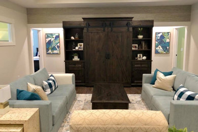 Inspiration for a mid-sized coastal open concept vinyl floor, brown floor and wallpaper living room remodel in Grand Rapids with white walls and a tv stand