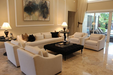 Example of a large transitional formal and open concept marble floor living room design in Miami with beige walls