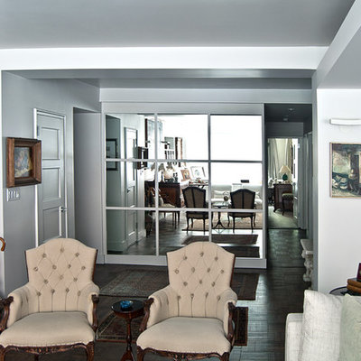Example of a mid-sized classic open concept dark wood floor living room design in New York with white walls, no fireplace and no tv