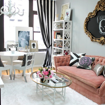Inspiration for a small eclectic enclosed light wood floor living room remodel in Kansas City with no tv and gray walls