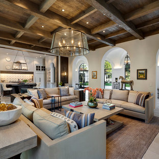 Expansive mediterranean open plan living room in Other with white walls, limestone flooring and grey floors.