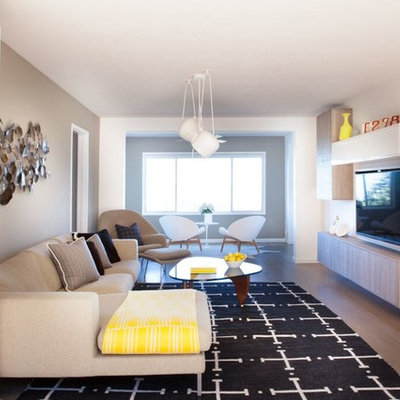 Inspiration for a mid-sized mid-century modern open concept light wood floor living room remodel in San Francisco with white walls, no fireplace and a wall-mounted tv