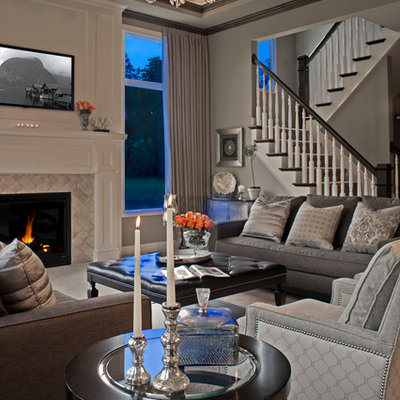 Inspiration for a large timeless formal and open concept carpeted living room remodel in Detroit with gray walls, a standard fireplace, a tile fireplace and a media wall