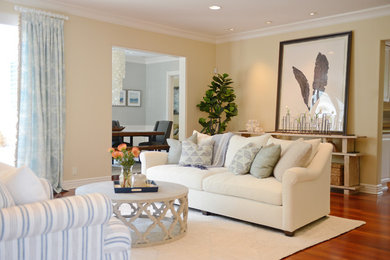 Beach style formal and enclosed medium tone wood floor living room photo in San Diego with beige walls