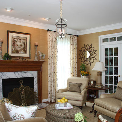 Elegant enclosed living room photo in DC Metro with beige walls, a standard fireplace and no tv