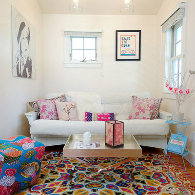 Living room - eclectic medium tone wood floor living room idea in Other with white walls