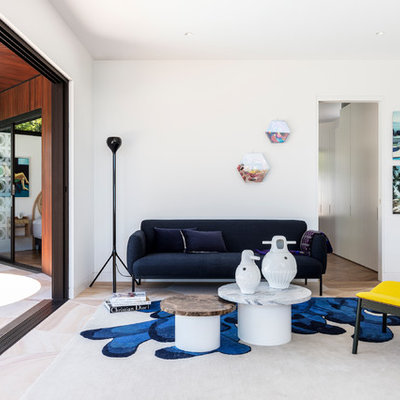 Living room - mid-century modern living room idea in Sydney with white walls and no fireplace