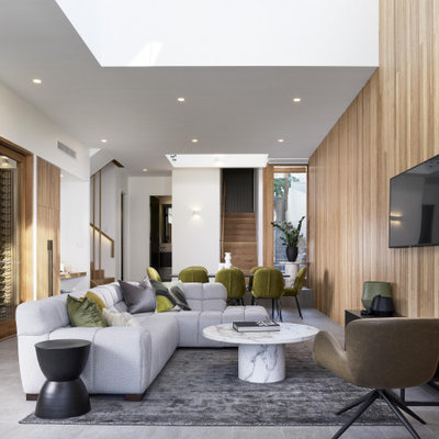 Minimalist open concept gray floor living room photo in Brisbane with white walls and a wall-mounted tv