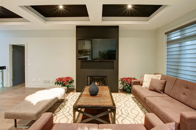 Example of a large minimalist open concept beige floor living room design in Toronto with black walls, a standard fireplace, a plaster fireplace and a wall-mounted tv