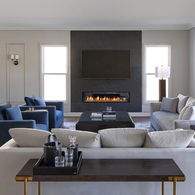 Living room - mid-sized contemporary open concept medium tone wood floor and brown floor living room idea in Los Angeles with black walls, a ribbon fireplace, a stone fireplace and a wall-mounted tv