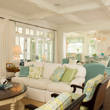 Open-plan family room and kitchen features coffered ceilings