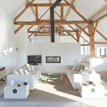 Open plan minimalist living space - Contemporary Barn Conversion in Wiltshire
