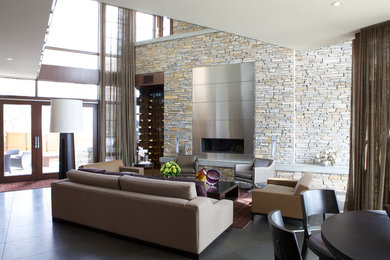 Inspiration for a large modern loft-style and formal living room remodel in Calgary with beige walls, a ribbon fireplace, no tv and a metal fireplace