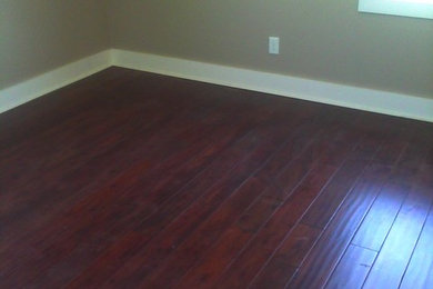 Inspiration for an enclosed dark wood floor living room remodel in Raleigh with beige walls, no fireplace and no tv
